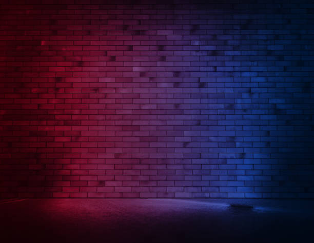 istock Brick wall background with neon light and wet asphalt. 1296135687