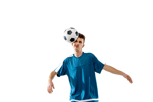 Painful. Funny emotions of professional soccer player isolated on white studio background. Copyspace for ad. Excitement in game, human emotions, facial expression and passion with sport concept.