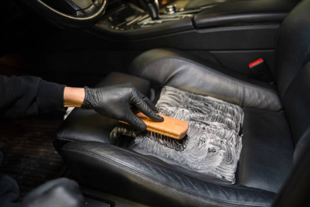 istock Professional cleaning process for leather car seats. Auto detailing concept 1296138690
