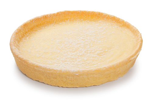 Studio shot of a lemon tart cut out against a white background.