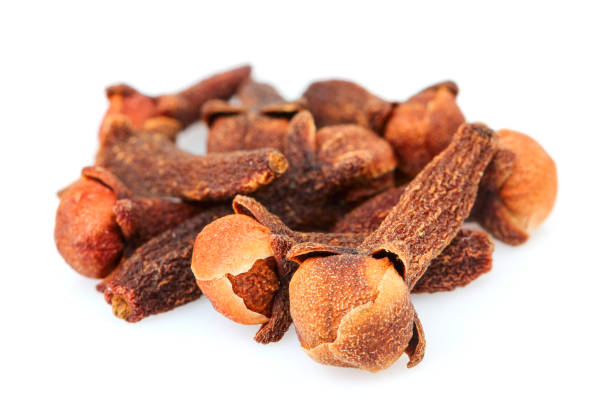istock Heap of Spice cloves isolated on white. 1296140058