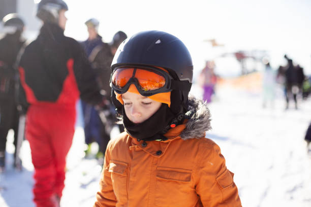 istock A boy in equipment is skiing on a snowy slope. 1296141093