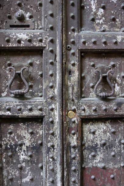 istock wooden door at a building 1296143206