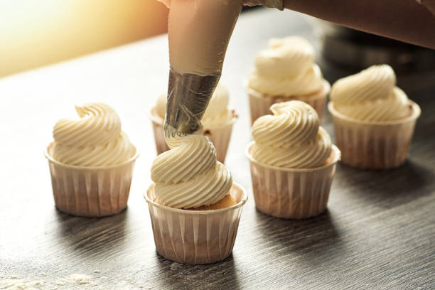 istock Closeup of a pastry chef making a cream from a bag 1296145101