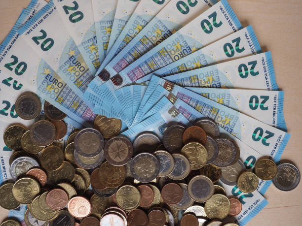 istock Euro notes and coins, European Union 1296145917