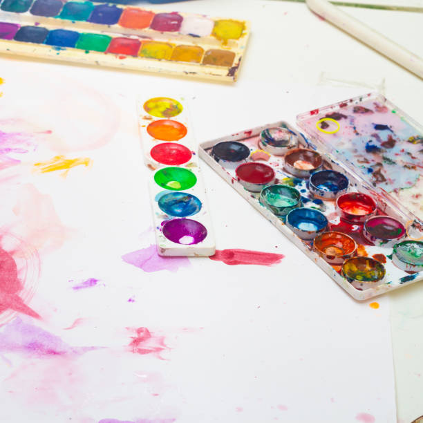 istock Paint watercolor after coloring by a child, soiled paints, mixed colors 1296147501