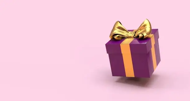 Photo of purple gift on pink background