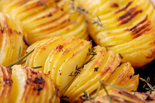 Hasselback potatoes are a Scandinavian delicacy with it’s origins in Sweden. The humble potato was transformed by a chef in the Hasselbacken Hotel in Stockholm and the dish has taken its name from the Hotel. A skewer is placed though the potato and it is then thinly sliced with the skewer stopping the knife cutting the whole potato. The raw potato is then coated with melted butter and placed in a roasting pan, thyme, rosemary and garlic are added. Cooking time is about an hour and every 15mins or so coat the potatoes with the melted butter from the roasting pan.