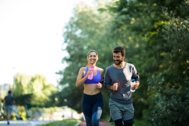 istock Young cute couple jogging. Healthy lifestyle. 1296152525