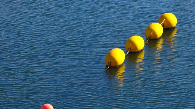 Yellow buoys on a rope in the sea