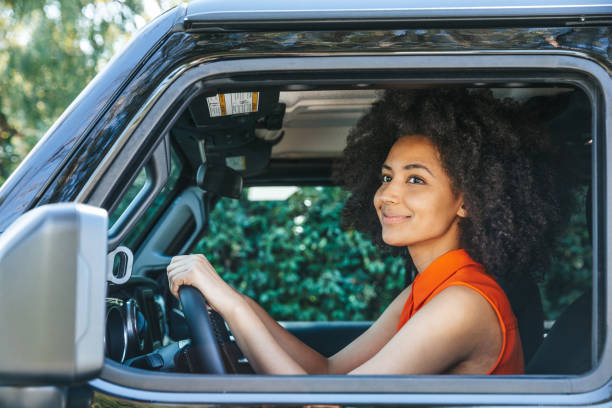 istock Woman driving 1296154250