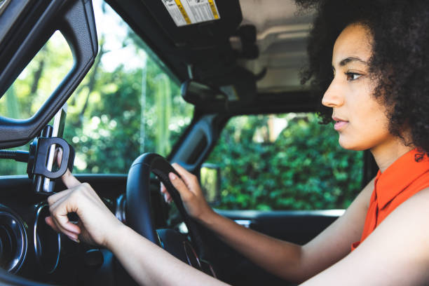 istock Woman setting destination address on the map on the phone 1296154346