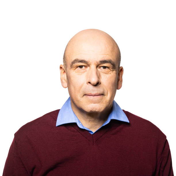 istock Portrait of a bald man staring at camera 1296154593