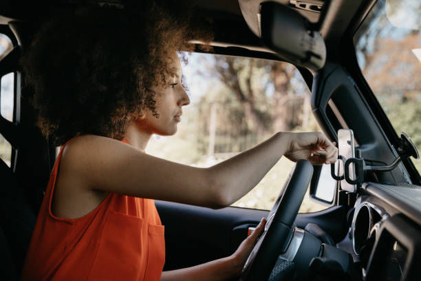 istock Woman setting destination address on the map on the phone 1296154809