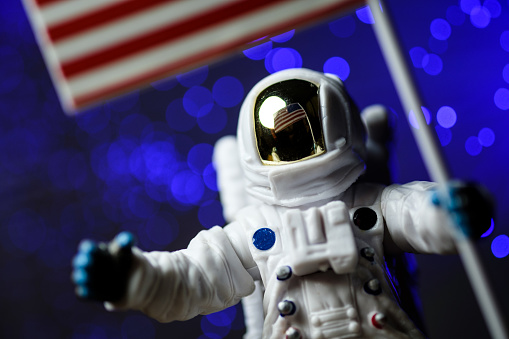 toy astronaut with american flag