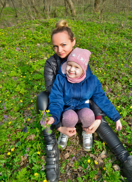 istock The family is walking in the spring forest. 1296157563