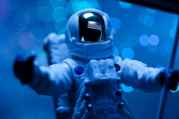 istock Toy astronaut with american flag 1296159000