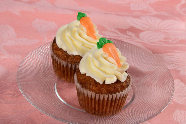 istock Carrot Cake Cupcakes with Cream Cheese Frosting 1296159332