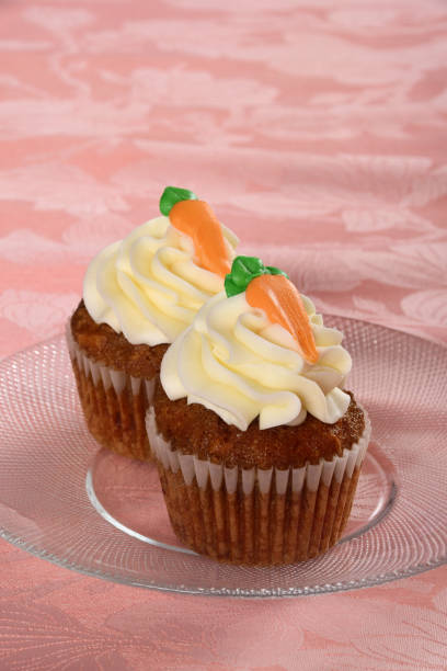 istock Carrot Cake Cupcakes with Cream Cheese Frosting 1296159455