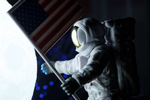 istock Toy astronaut with american flag 1296160494