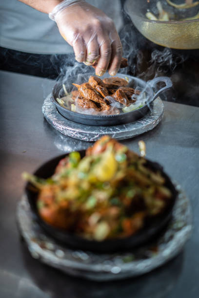 istock Indian kebab platter in hot sizzling plate 1296160893