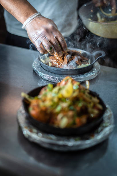 istock Indian kebab platter in hot sizzling plate 1296160909