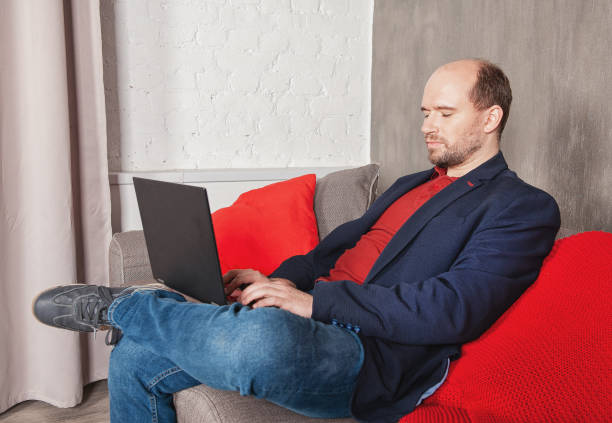 istock Business man with laptop working or study at home 1296161147