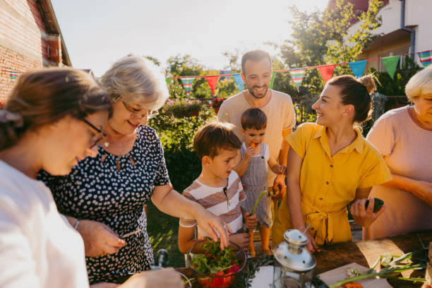 istock Family cooking together 1296161899