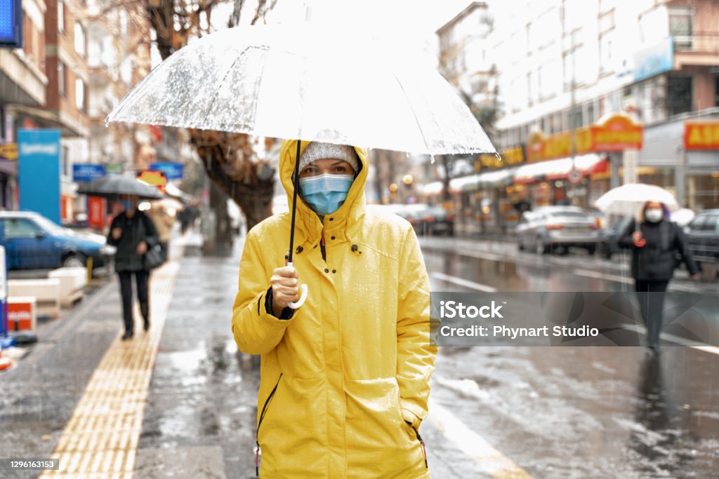Woman with umbrella  on rainy day Rain Stock Photo