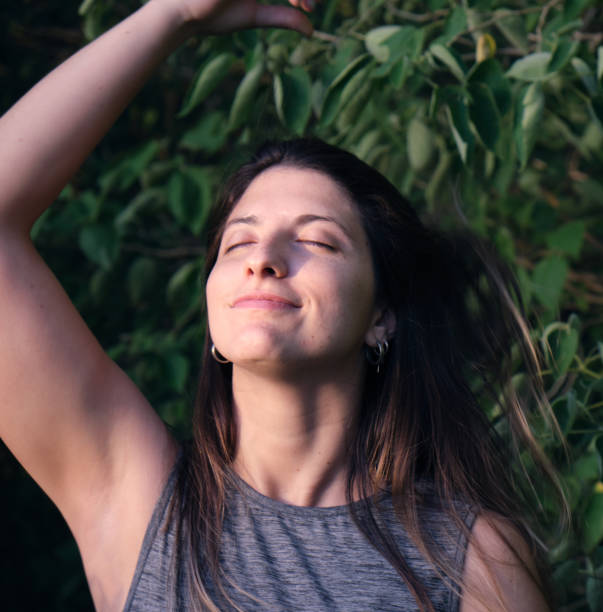 istock model grabbing  her hair  in the woods 1296163431