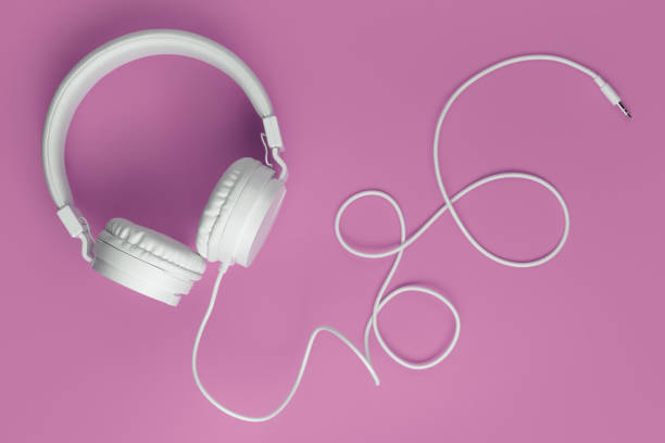 istock Cool white headphone on pink background. Music concept. 1296163829