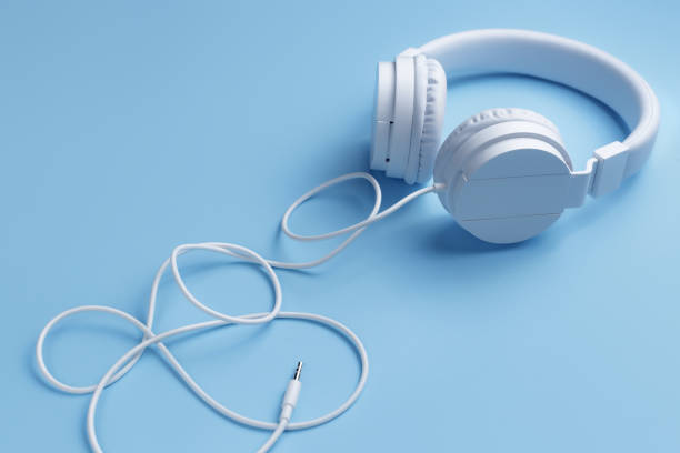 istock White headphone on blue background. Music concept. 1296163854