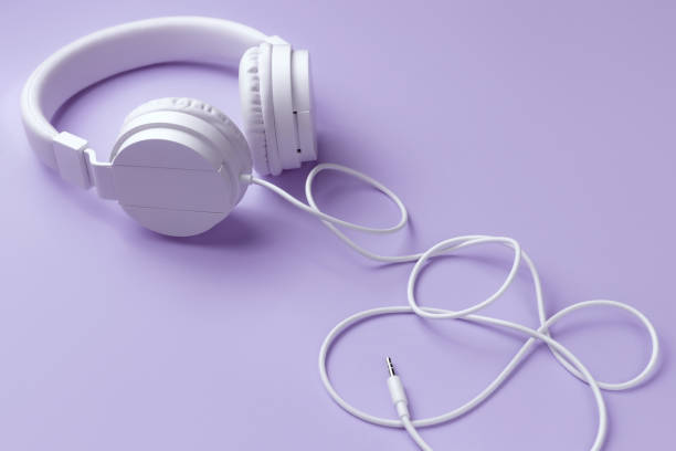 istock White headphone on blue background. Music concept. 1296163855