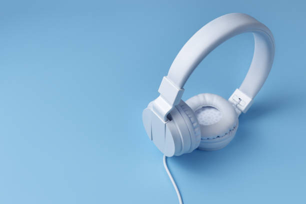 istock White headphone on blue background. Music concept. 1296163857