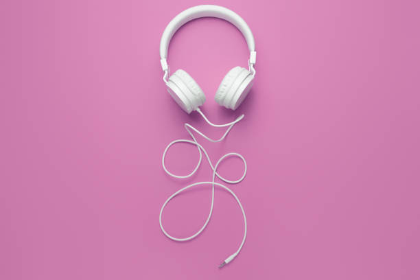 istock Cool white headphone on pink background. Music concept. 1296163886