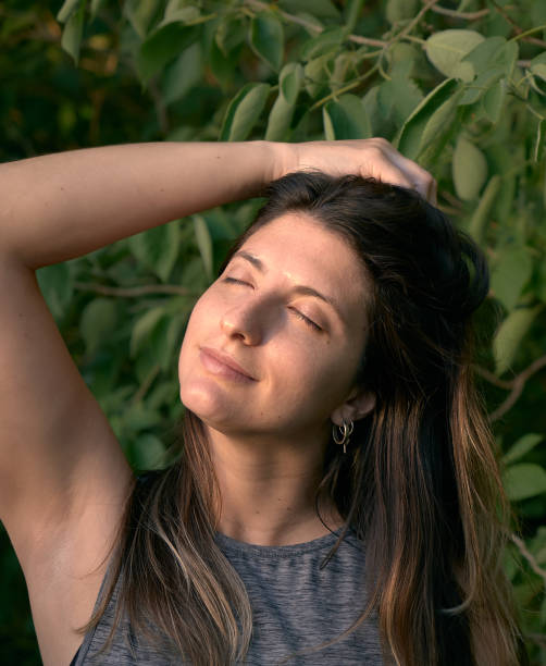 istock model grabbing  her hair  in the woods 1296163891
