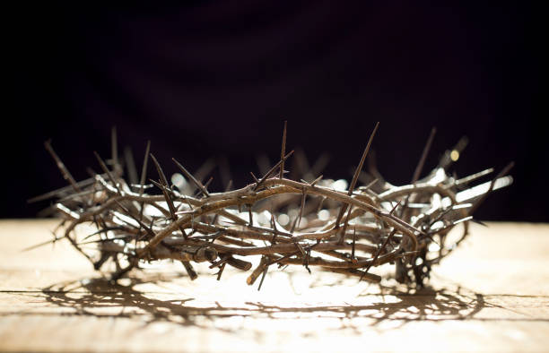 istock Crown of Thorns on an Old Wood Background 1296166565