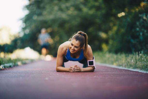 istock Young woman is doing planks. 1296168218