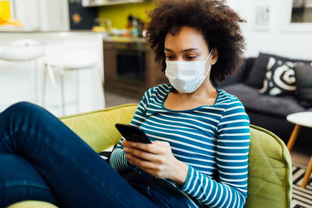 istock Young African American woman working from home 1296169335