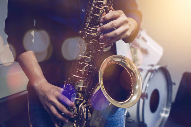 istock musician plays tenor saxophone on stage 1296169776