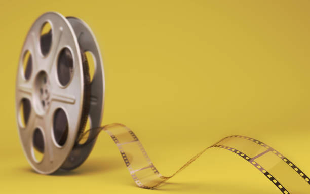 istock 35mm film strip Yellow Background 1296170723
