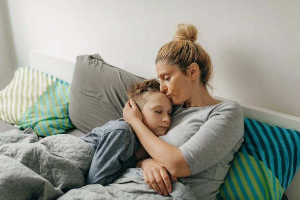 istock Mother and son in bedroom spend some quality time 1296171806