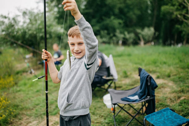 istock Young boy fishing on the river 1296171883