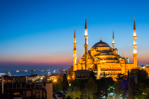 Illuminated Mosque with Dramatic Sunset with Copy Space