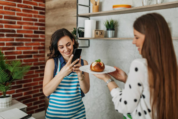 istock Young women preparing food in the kitchen 1296174096