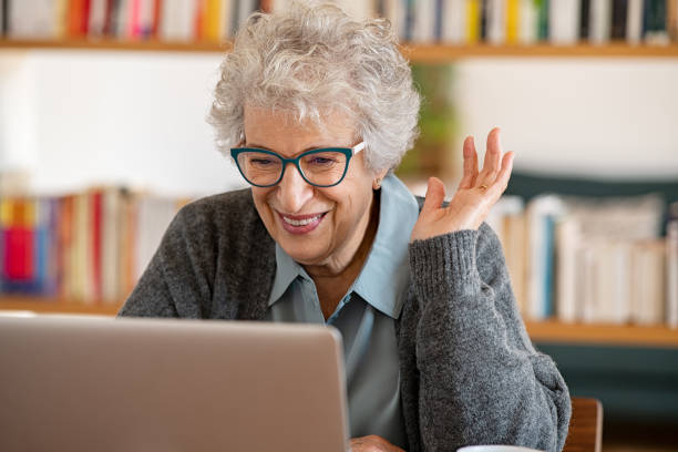 istock Senior woman using laptop to make a video call 1296176529
