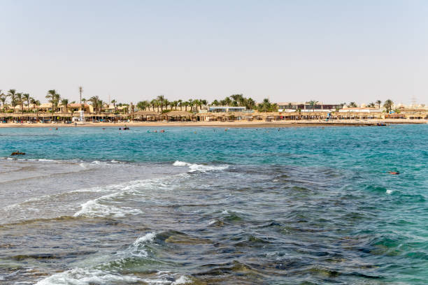 istock People relaxing on the beach in Hurghada 1296176576