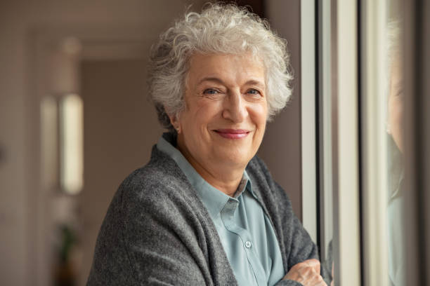 Happy senior woman smiling at home
