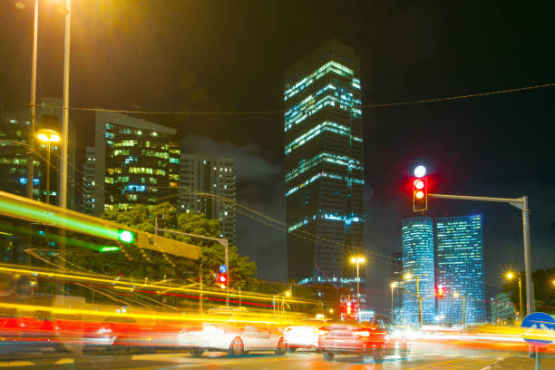istock Tel Aviv At Night, Skyscraper Construction Sites and traffic In Tel aviv 1296179371