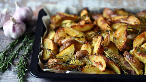 istock Baked Potato with rosemary and garlic. 1296180006